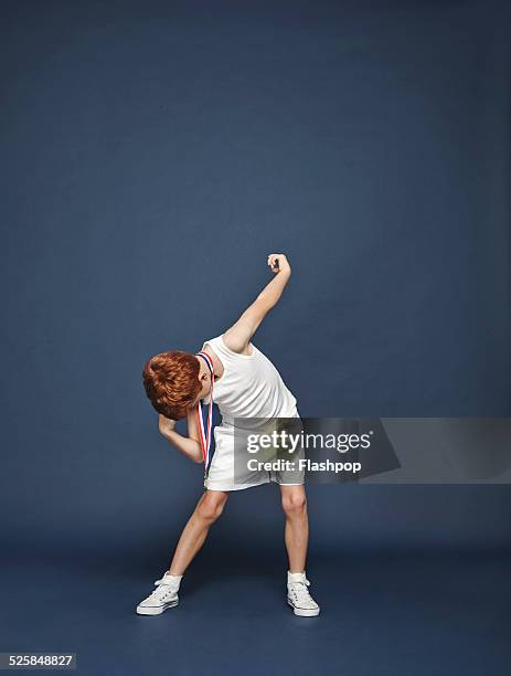 boy posing with medal - pride stock pictures, royalty-free photos & images