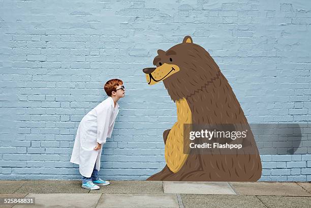 boy dressed as a vet with cartoon bear - beer friends stockfoto's en -beelden