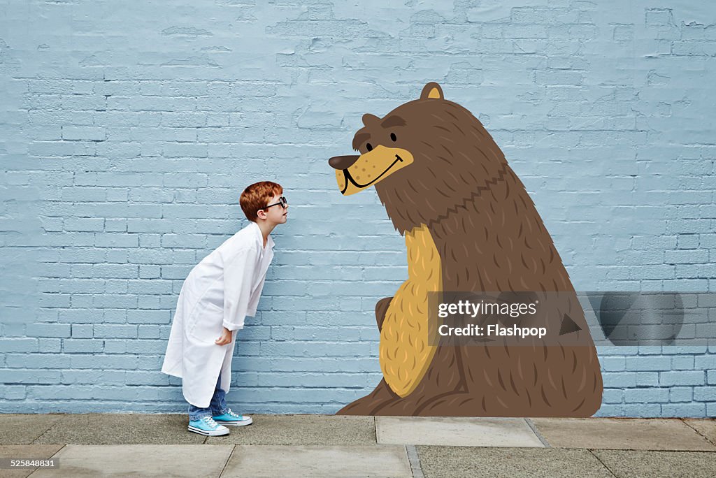 Boy dressed as a vet with cartoon bear