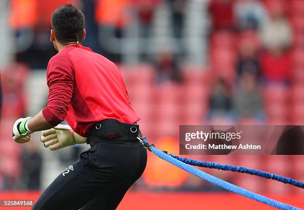 Goalkeeper Paulo Gazzaniga of Southampton warms up wearing a resistance belt