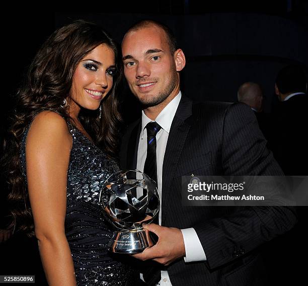 Wesley Sneijder of Inter Milan and the Netherlands receives the UEFA Champions League award for best midfielder for season 2009-2010 with his wife...
