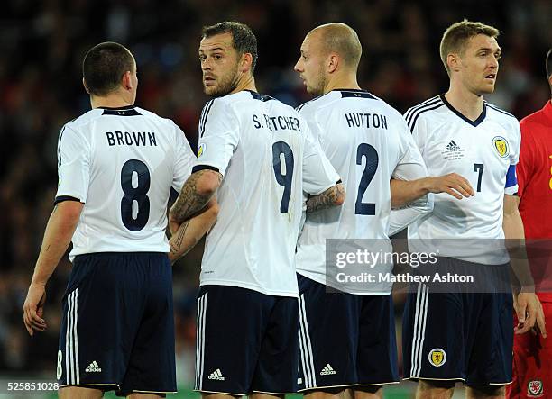 Steven Fletcher of Scotland in the defence wall