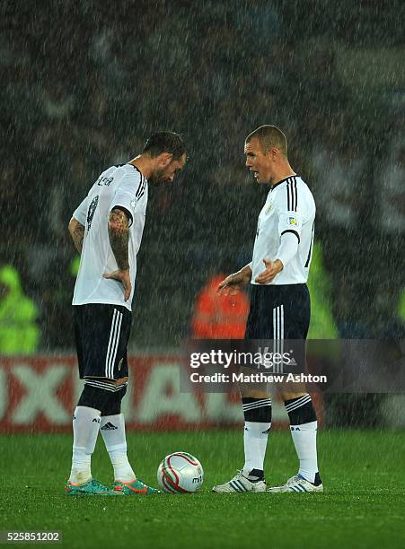 Dejected Steven Fletcher and Kenny Miller of Scotland after Wales scored the winning goal