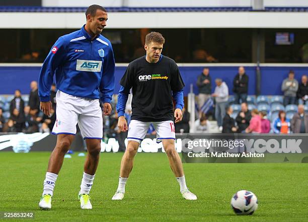 Anton Ferdinand of Queens Park Rangers chooses not to wear a kick it out anti-racism t-shirt as he warms up alongside Jamie Mackie of Queens Park...