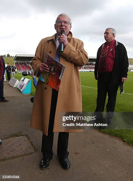 Football commentator John Motson reads out the teams at Sixfields stadium ahead of the match between Northampton Town and Burton Albion