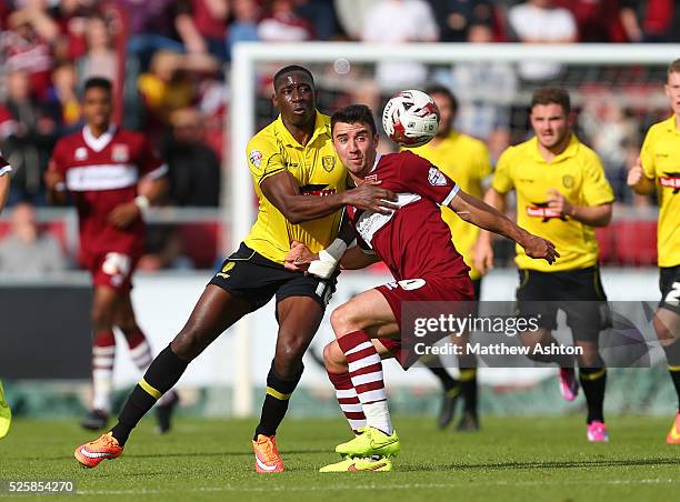 Lucas Akins of Burton Albion and Enda Stevens of Northampton Town