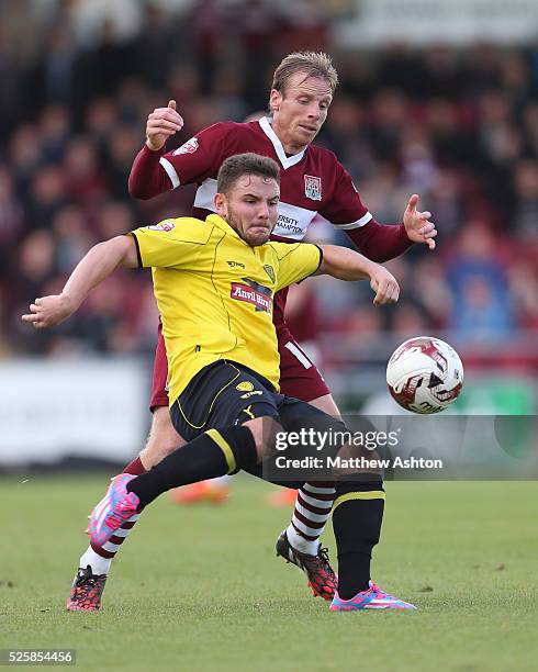 Alex MacDonald of Burton Albion and Ricky Ravenhill of Northampton Town