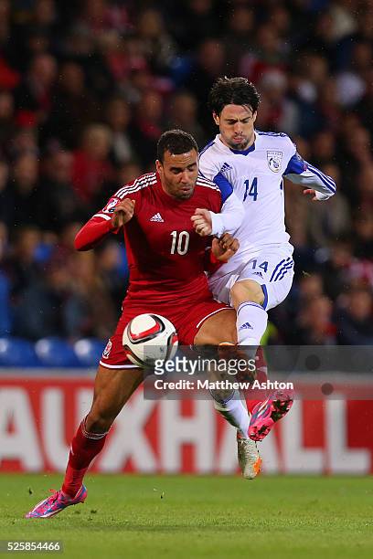 Hal Robson-Kanu of Wales and Vincent Laban of Cyprus
