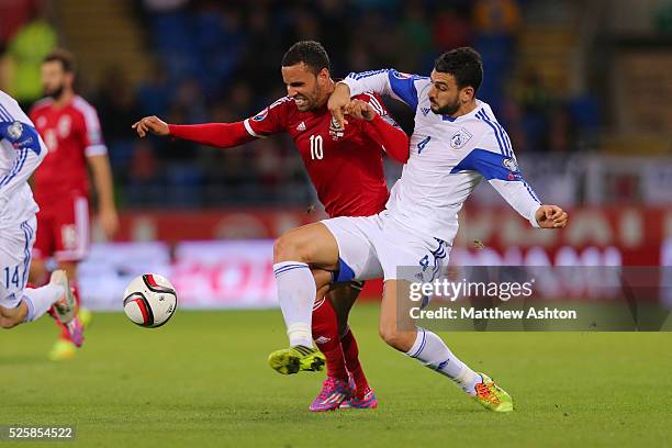 Hal Robson-Kanu of Wales and Giorgos Merkis of Cyprus