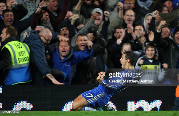 Eden Hazard of Chelsea celebrates after he scores from the penalty spot to make it 3-3