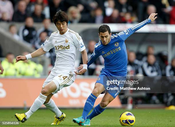 Sung-Yeung Ki of Swansea City and Eden Hazard of Chelsea