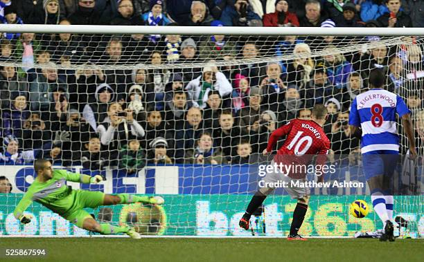Wayne Rooney of Manchester United scores a penalty goal to make it 1-2