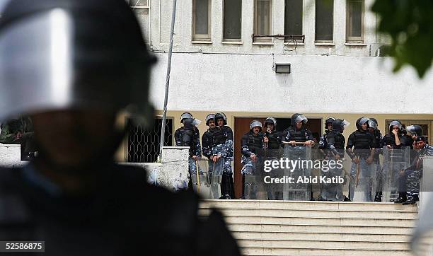 Palestinian riot policemen guard parliament during a protest demanding an investigation into the case of the murdered docent Yasser Al-madhoon who...