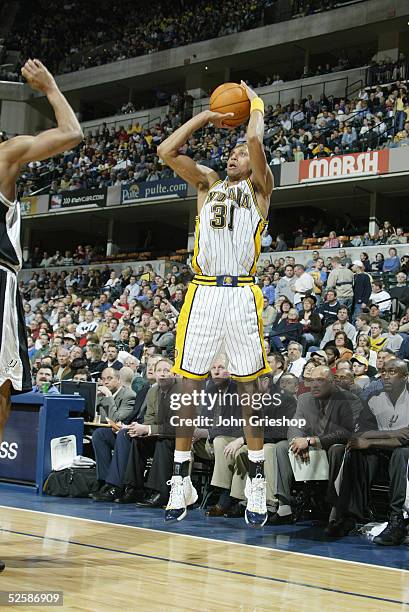 Reggie Miller of the Indiana Pacers takes a jump shot during the game against the San Antonio Spurs on March 23, 2005 at Conseco Fieldhouse in...