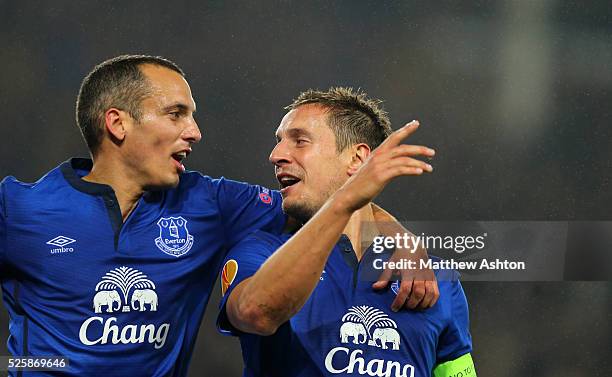 Phil Jagielka of Everton celebrates after scoring a goal to make it with Leon Osman