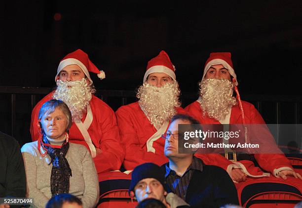 Three snooker fans dress as Father Christmas' at the final of the 12Bet.Com UK Championships 2010