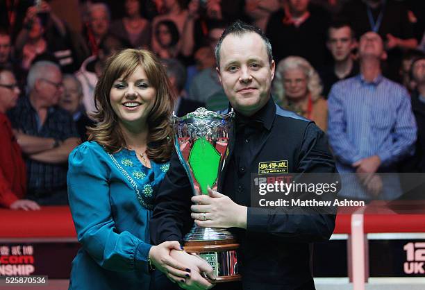 Scotland's John Higgins celebrates winning the 12Bet.Com UK Championship with a 10 frames to 9 victory over Mark Williams with his wife Denise