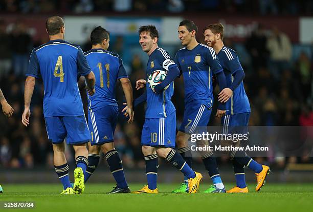 Lionel Messi of Argentina celebrates with team mates after Cristian Ansaldi of Argentina scores to make it 1-1