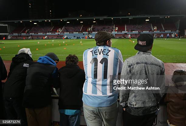 Fan wearing the shirt of Carlos Tevez of Argentina at The Boleyn Ground, Upton Park stadium, home of West Ham United