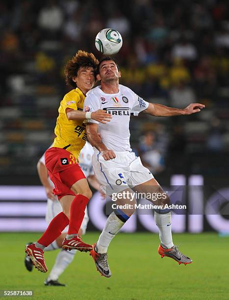 Jo Jae Cheol of Seongnam Ilhwa Chunma FC and Dejan Stankovic of FC Internazionale Milano