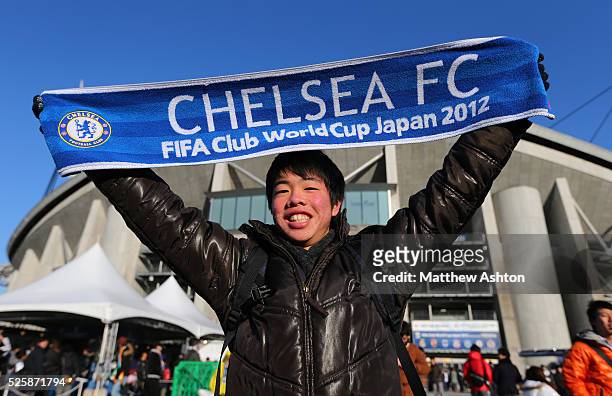 Fan from Japan holding a Chelsea scarf outside the Toyota Stadium