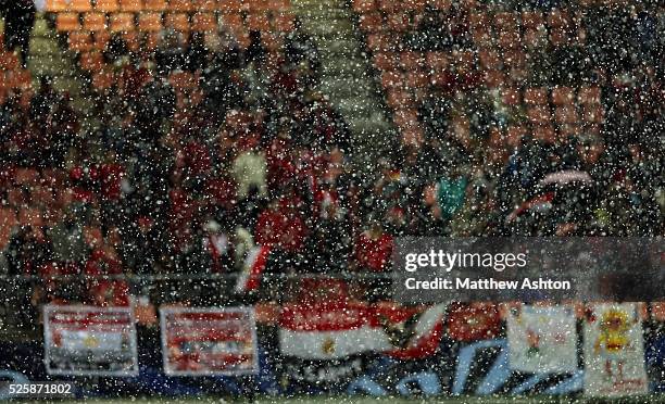 Snow falls in the Toyota Stadium in Toyota, Japan in front of freezing cold football supporters from Egypt, watching the representative of Africa, Al...