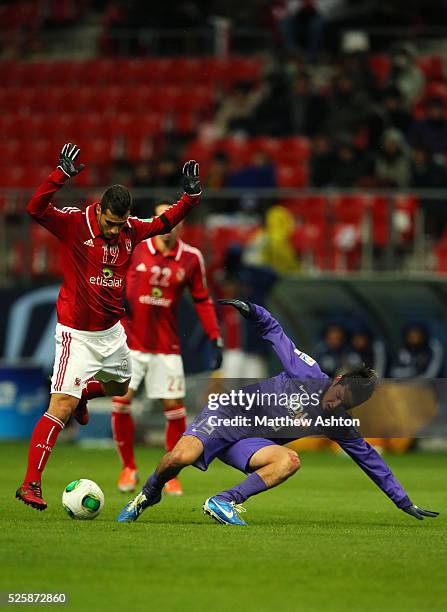 Abdalla Said of Al-Ahly SC and Yojiro Takahagi of Sanfrecce Hiroshima