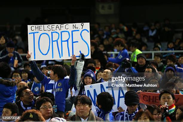 Fans of Chelsea from Japan hold up banners celebrating Fernando Torres