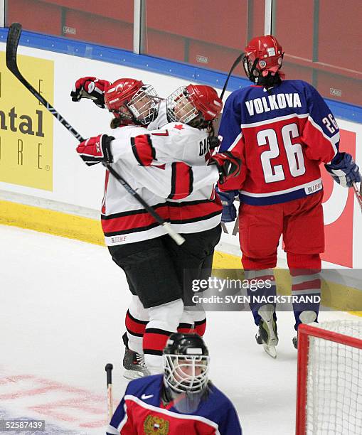 Canadians Cassie Campbell and Gillian Apps celebrate Campbells' second and the teams 12th goal against Russia in the IIHF Womens World Championship...