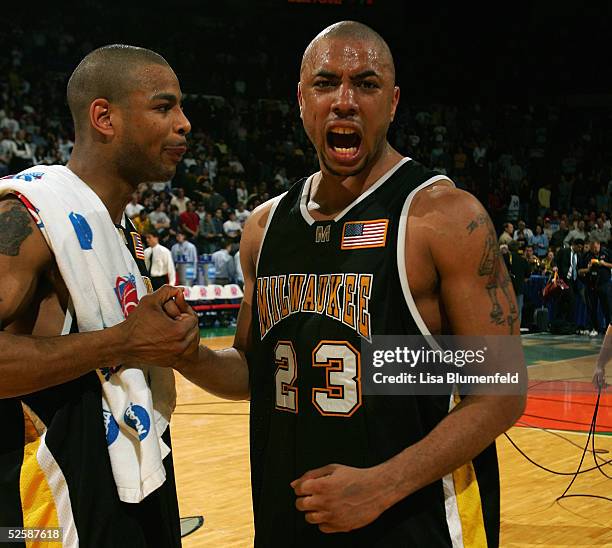 Ed McCants and James Wright of the Wisconsin-Milwaukee Panthers celebrate during the game with the Boston College Eagles in the second round of the...