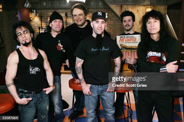 Members of heavy metal band Anthrax Danny Spitz, Frank Bello, host Eddie Trunk, Scott Ian, Charlie Benante, and Joey Belladonna pose for a photo...