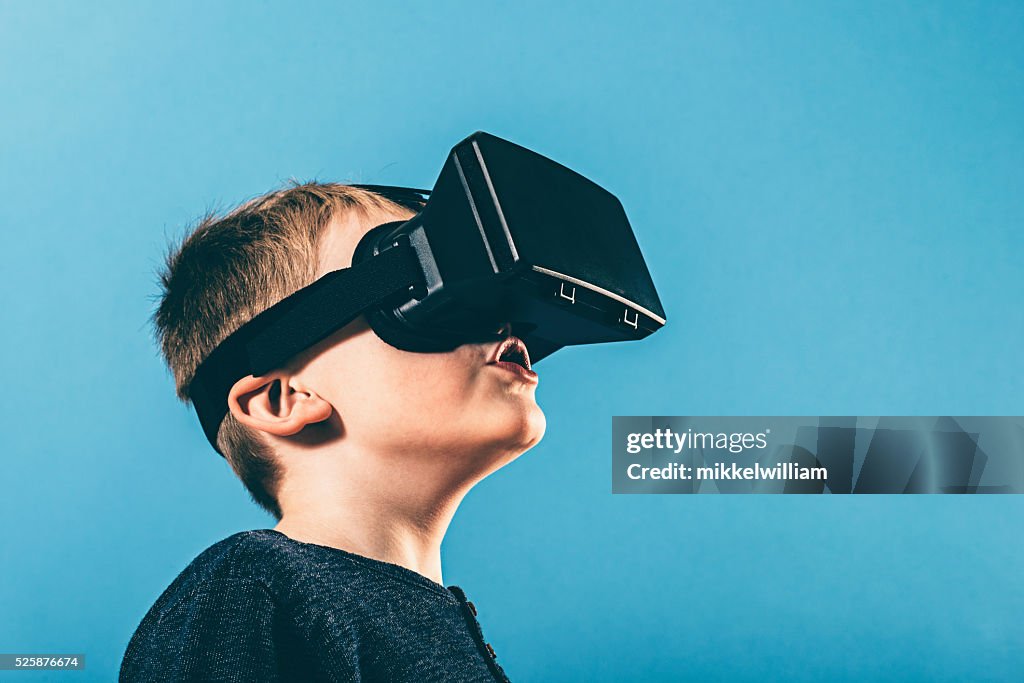 Boy is surprised by content on VR glasses