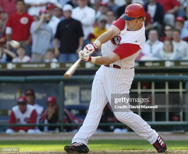 Adam Dunn of the Cincinnati Reds hits his second home run of the game off of New York Mets pitcher Braden Looper to tie the game in the bottom of the...