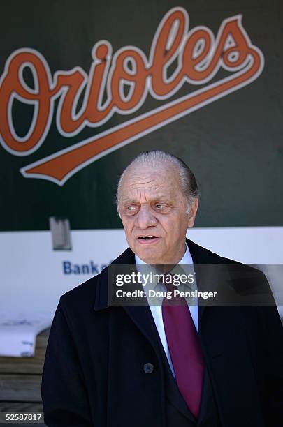 Owner Peter Angelos of the Baltimore Orioles watches pregame festivities from the duggout prior to the Baltimore Orioles defeating the Oakland...