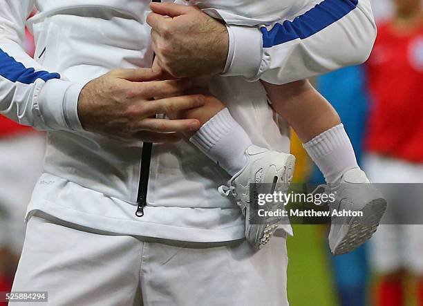 Klay Rooney wears special edition trainers to mark the 100th appearance of his father Wayne Rooney of England