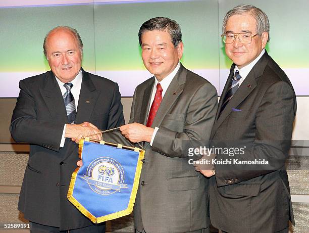 Japan Football Association Captain Saburo Kawabuchi , FIFA President Joseph Blatter and FIFA Executive member Junji Ogura attend a press conference...