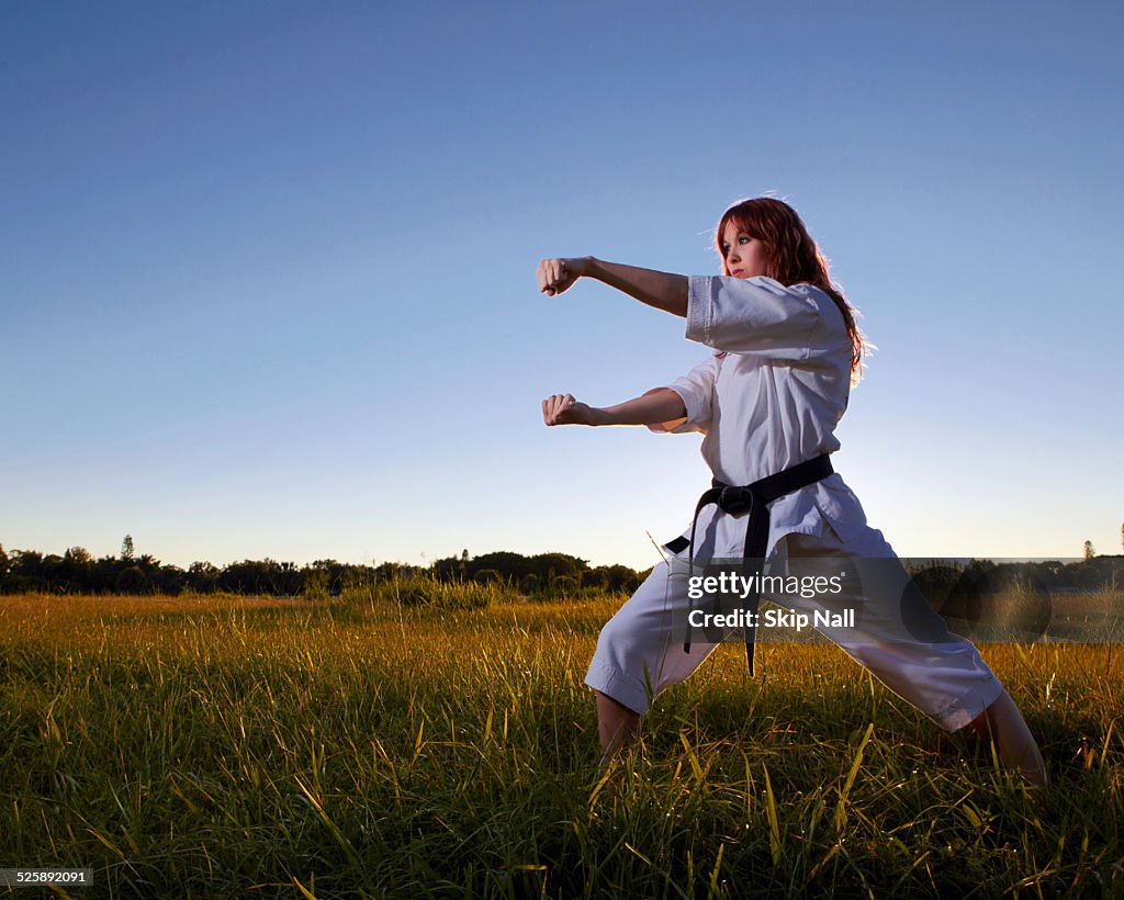 Female martial arts champion practicing