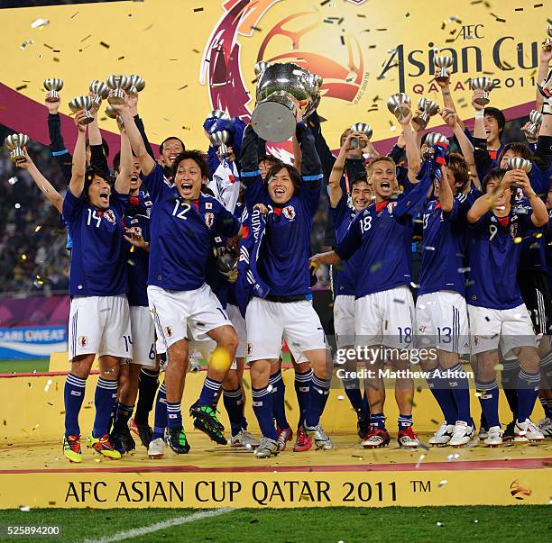 Yasuhito Endo of Japan with the Asian Cup trophy after defeating Australia 0-1 in the 2011 Final