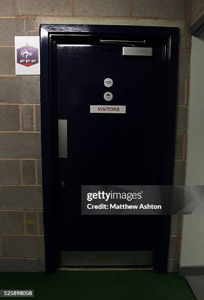 The France team crest outside the visitors changing room at the Greenhouse Meadow Stadium, home of Shrewsbury Town