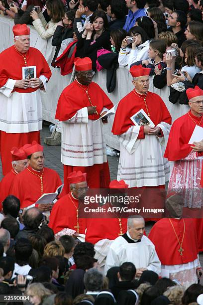 Nigerian Cardinal Francis Arinze leads with other unidentified Cardinals the procession as the body Pope John Paul II is carried to St. Peter's...