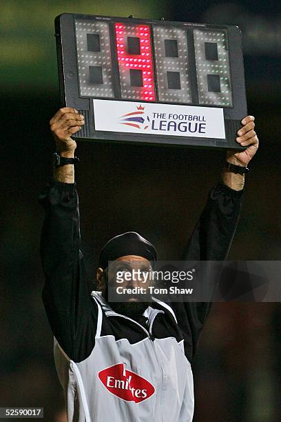 Fourth official Jarnail Singh indicates additional time during the Coca-Cola Championship match between West Ham United and Leicester City at Upton...