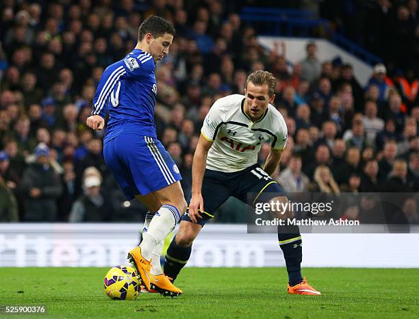 Eden Hazard of Chelsea back heels the ball as Harry Kane of Tottenham Hotspur looks on