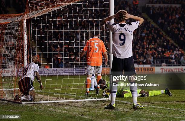 With Jermain Defoe of Tottenham Hotspur in the net, Richard Kingson of Blackpool saves on the line from Roman Pavlyuchenko