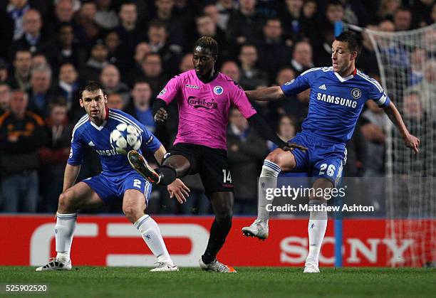 Dame N'Doye of FC Copenhagen gets in between Branislav Ivanovic and John Terry of Chelsea