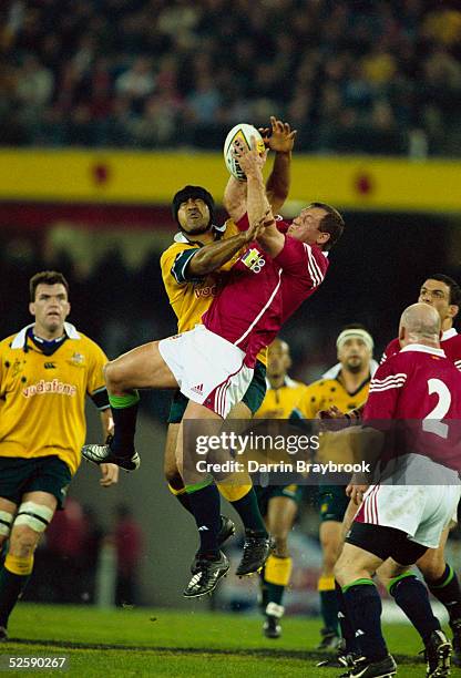 Richard Hill of the British Lions goes for the ball with Toutai Kefu of Australia during the British and Irish Lions tour match between Australia and...