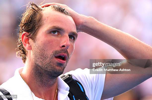 Julien Benneteau of France walks off court at the Australian Open, 2013