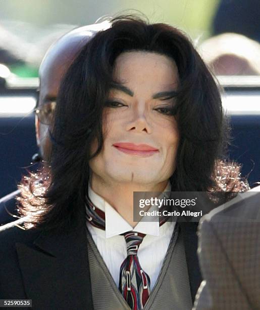 Michael Jackson arrives for his child molestation trial at Santa Barbara County Superior Court April 5, 2005 in Santa Maria, California. Jackson is...
