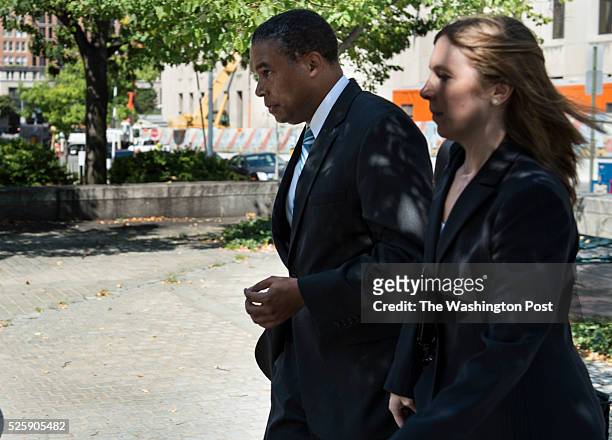 Mark H. Long Mayor Vincent Gray's campaign chauffeur, left, leaves the H. Carl Moultrie I Courthouse following a hearing in Washington, D.C., on...