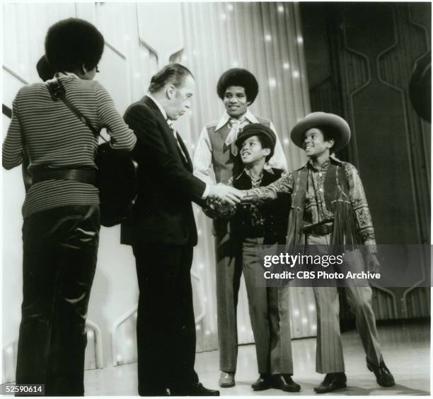 American variety show host Ed Sullivan greets the members of the American pop group The Jackson 5 during their guest appearance on 'The Ed Sullivan...