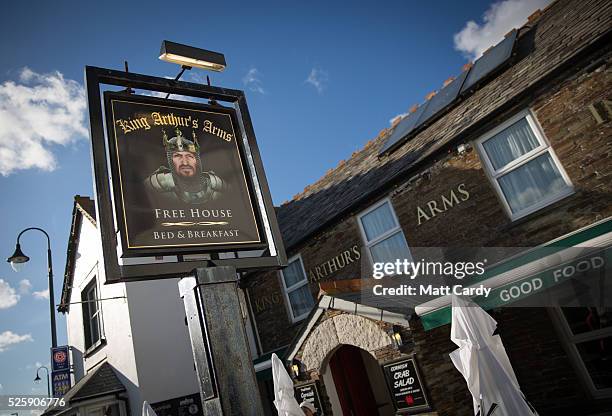 The sun illuminates the sign for the King Arthur's Arms in Tintagel on April 27, 2016 in Cornwall, England. The English Heritage managed site and the...